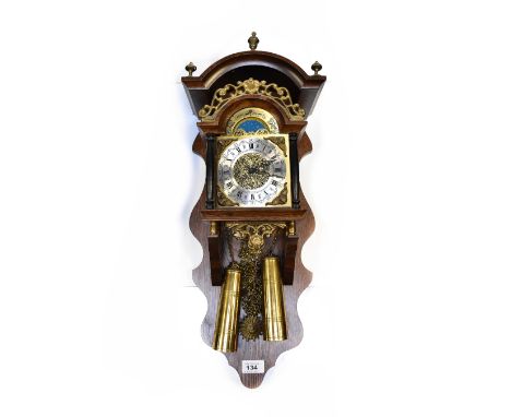 A reproduction oak cased wall clock, the brass dial with rolling moon phase and silvered chapter ring set with Roman and Arab
