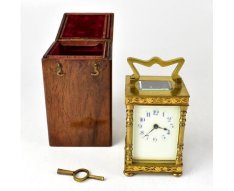 A late 19th century French gilt brass carriage clock, marked for R & Co of Paris, with winding key, in oak travelling case, h