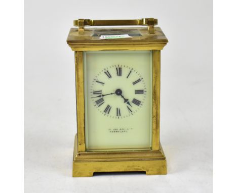 A brass cased carriage clock, the ivorine dial set with Roman numerals, maker's mark rubbed, Snow and Ashworth Harrogate, hei