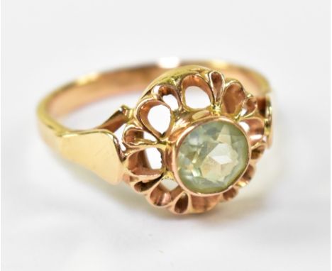 A 9ct yellow gold ring set with central pale green stone, size O, Polish hallmark .800, approx 3.4g.
