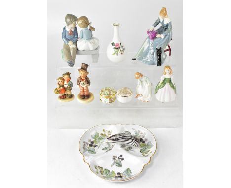 Three Royal Doulton figures comprising HN3098 'Dorothy', modelled by Peggy Davies, HN3397 'Let's Play', first year of issue 1