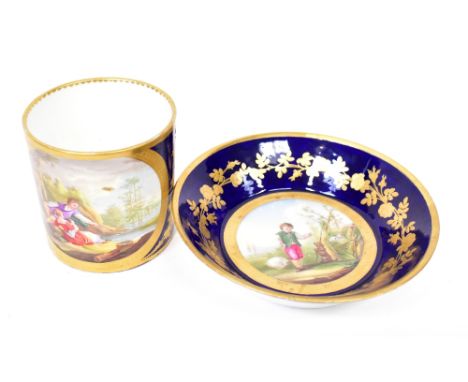 SÈVRES PORCELAIN; an 18th century hand painted cabinet cup and saucer, the cup painted with a panel of a courting couple next