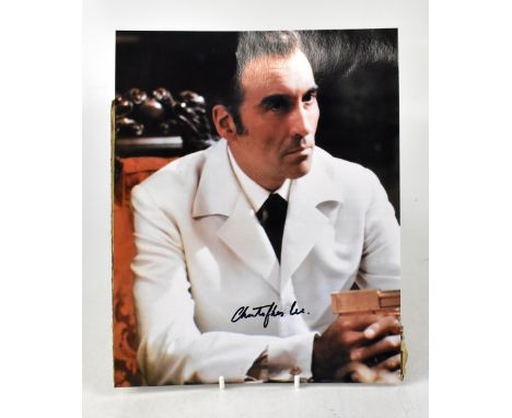CHRISTOPHER LEE; a coloured photograph of the acting star, bearing his signature, 25 x 20cm.We have not authenticated this si