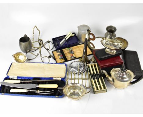 A collection of various mixed silver plated and other metal items to include trays, three-piece tea set, epergnes, mugs, toas