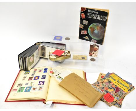 STAMP ALBUMS; a mid-20th century worldwide stamp collection along with an album of first day covers dating from 1969-1973, fo