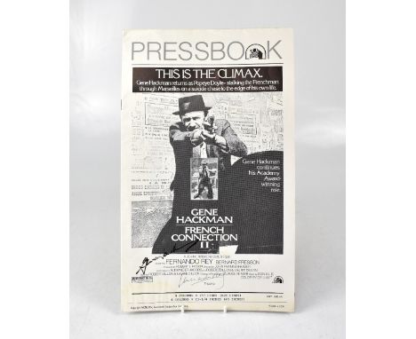 GENE HACKMAN; a press book publication for 'French Connection II', bearing the star's signature.We have not authenticated thi