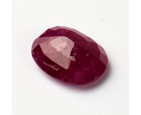 A loose 4.30 carat oval ruby with AGI insurance valuation.