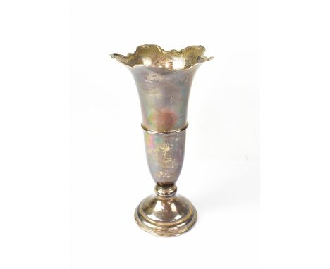 An Elizabeth II hallmarked silver vase, with shaped flared rim, on torpedo body, terminating in a stepped ring weighted base,