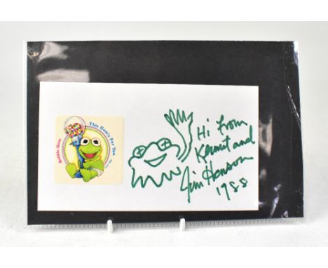 JIM HENSON; a single piece of card inscribed 'Hi from Kermit', bearing the star's signature beside a doodle, dated 1988.We ha