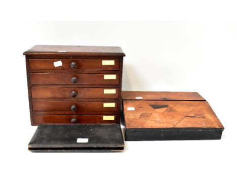 An early 20th century marquetry writing slope with pull-out pen tray and velvet slope, a cased geometry set and a small five-