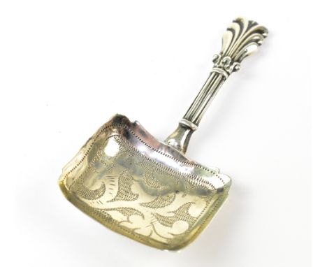 An early 19th century hallmarked silver caddy spoon, with square floral decorated bowl and handle with Classical plume design