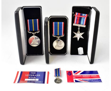 Three boxed medals comprising The Veterans Star and The National Service Medal, both relating to 23178119 Pte R.F. Duffey Roy