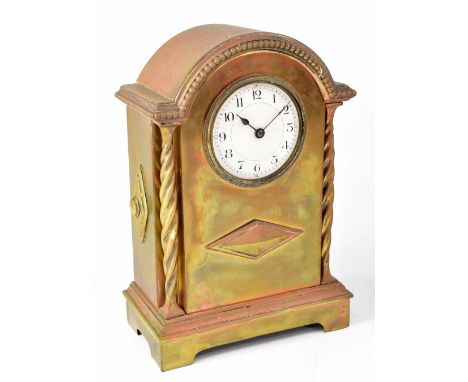 An early 20th century brass cased mantel clock, the enamelled dial set with Arabic numerals, dome-topped case with wrythen co