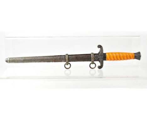 A German WWII Army dress dagger, the 10" unmarked blade mounted with a butterscotch amber-coloured wound grip, with scabbard,