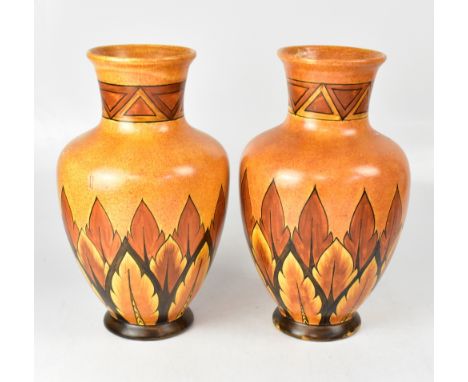 CLEWES &amp; CO; a pair of large Chameleon ware hand painted bulbous vases with triangle repeating pattern border to the neck