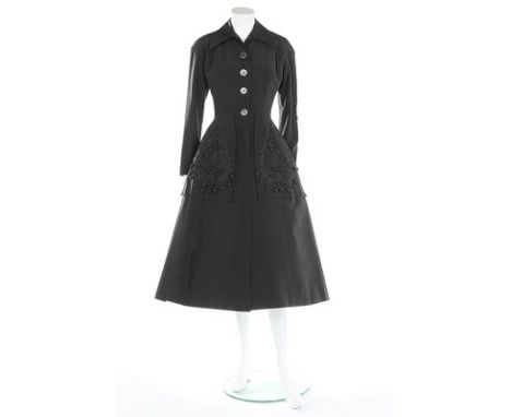 A Hattie Carnegie for I Magnin black faille evening coat, circa 1949, large woven label similar to that of 1920s Paquin, the 