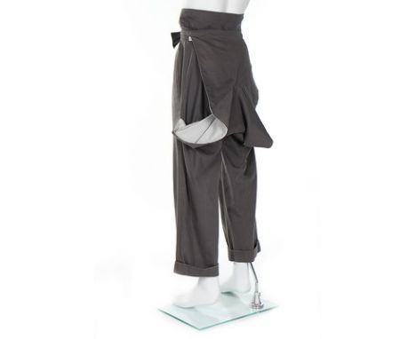 A rare and early pair of John Galliano grey cotton gabardine trousers, 'Fallen Angels' collection, Spring-Summer, 1986, large