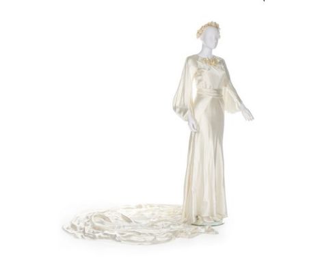 A fine Jeanne Lanvin couture bridal gown, Summer 1935, labelled and numbered 22872 to the slip, the bias-cut gown with large 