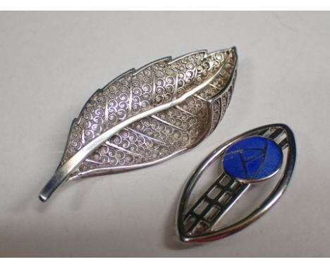 Two silver brooches including an enamel example