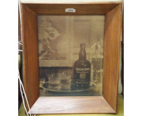 A Queen Anne Scotch Whisky illuminated teak frame advertising sign, 45cm high x 38cm wide (af) Condition Report: Available up