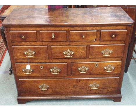 A Georgian oak chest of drawers with brass fittings on bracket feet, 84cm high x 103cm wide x 44cm deep Condition Report:Good