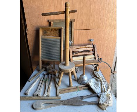 A quantity of vintage kitchenalia to include washboards, mangle, dolly stick, dolly pegs etc.