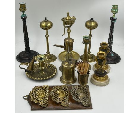 Brass items comprising a pair of brass Empire style candlesticks 15cm h with ram's head supports, a French Pigeon lamp, a gim