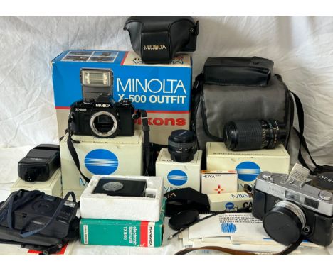 Minolta X-500 Outfit to include camera body, 50mm f1.7 lens, 132PX electronic flash, wide band neck strap, ever ready camera 