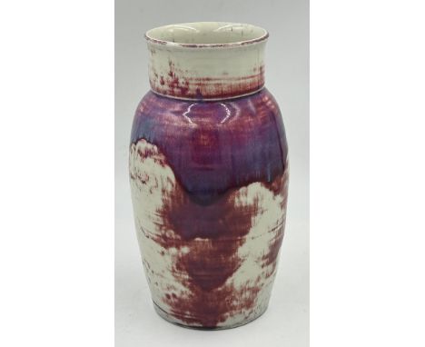 Ruskin Pottery, a high fired vase, 1924 in shouldered form in a cranberry/purple glaze. 28.5cm h, neck diameter 11.5cm. Impre