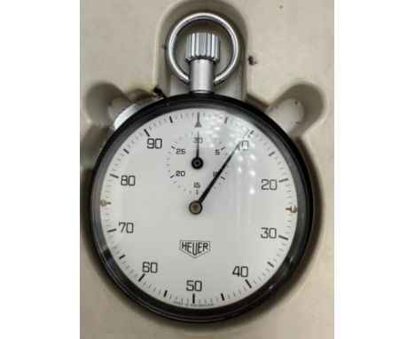 An Heuer stopwatch with box in good working order.