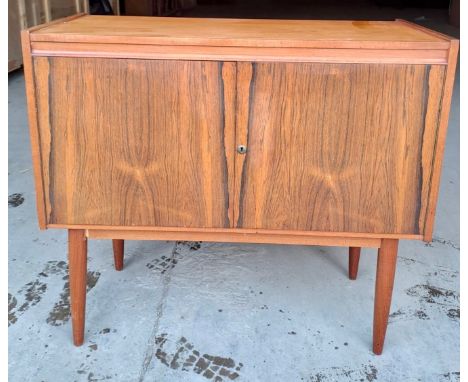 A mid 20thC drinks cabinet. 88cm h x 98cm w x 43cm d.