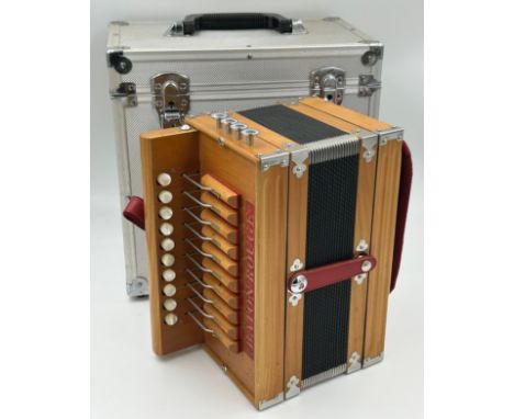 A Baton Rouge 4-stop Cajun Melodeon with a 4-stop coupler system, 18 fold bellows, single row of treble buttons, white metal 