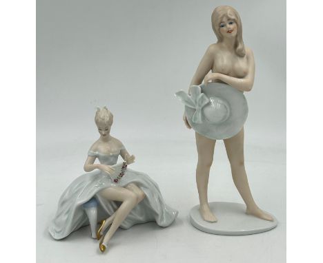 Two Wallendorf female figurines. Nude lady with hat 27cm h impressed mark to base 1920 and a seated lady 15.5cm h marked H 15