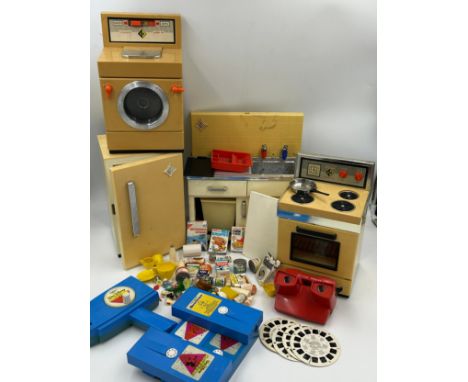 A collection of toys to include a Casdon battery operated toy oven/hob, washing machine and fridge with matching sink unit an