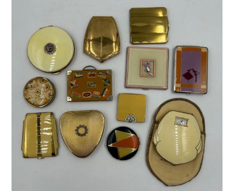 A collection of compacts comprising: a cream enamelled powder and rouge compact with watch by the Illinois Watch Case Company