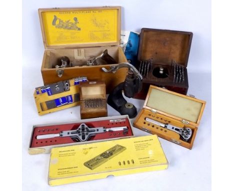 A collection of specialist watch maker's tools, including by Favorit Switzerland, with a Universal case opener, presses and b