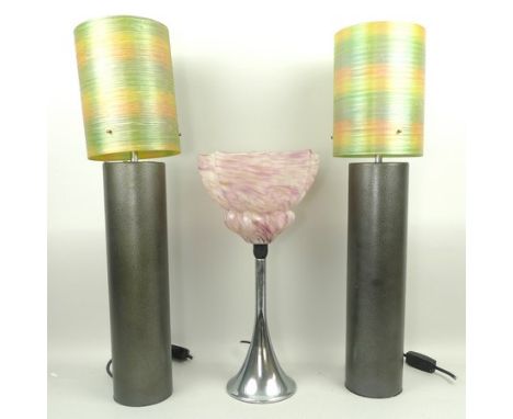 A pair of 1970's table lamps of cylindrical form, 61cm high, and a 1930's chromed table lamp with pink glass shade, 43cm high