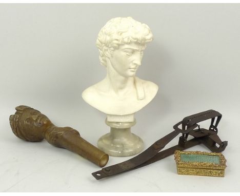 A taxidermists iron trap, 20cm long, a resin model of a Roman female head, 14cm, a miniature plaster bust of David on a marbl