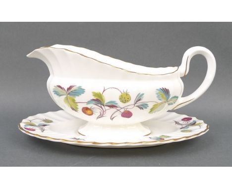 A Royal Worcester porcelain part dinner service decorated in the 'Strawberry Fair' pattern, comprising; meat platter, three v