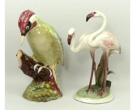 A Beswick figure of a woodpecker, 22cm high, and a Wien Keramis figure of a pair of flamingos, base with sticker for Royal Be