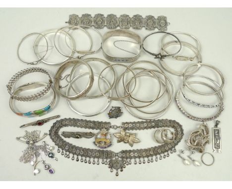 A quantity of silver jewellery including a frog brooch and a Parisian souvenir bracelet, a number of bangles including a Russ