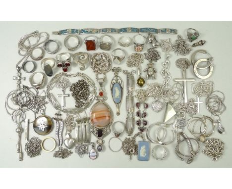 A quantity of silver jewellery, comprising; a teddy-bear pendant with articulated limbs, a quantity of silver rings, some set