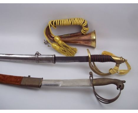 A modern cavalry sword and bugle, together with an Indian replica cavalry sword. (3)