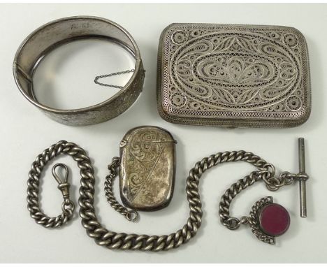 A Maltese filigree silver cigarette, vesta case with foliate engraving, Birmingham 1907, a silver bangle, foliate engraved on