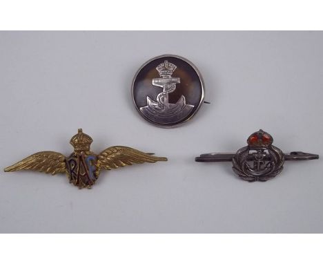 A WWII gilt and enamel RAF wings sweetheart brooch, Royal Navy silver and enamel bar brooch, and a Royal Navy silver and tort