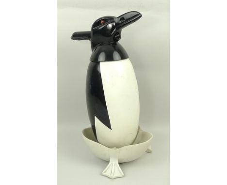 A Russian Soviet period soda siphon modelled as a penguin, enamel on a plastic drip tray, 36cm. 