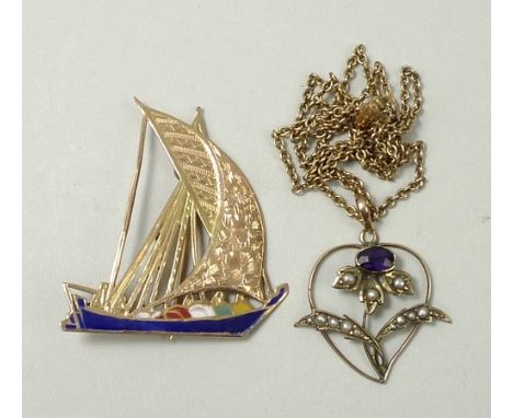 A 9ct gold, amethyst and seed pearl floral pendant on a belcher chain, and a gold and enamel brooch modelled as a Luzzu fishi