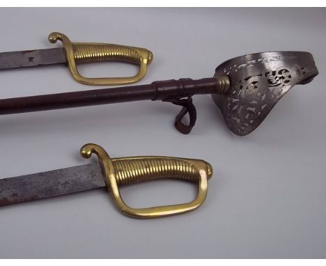 A pair of German military sabre's with brass grips, blade length 65cm, and an Officers sword with engraved and pierced hand g