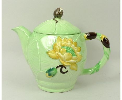 A Carltonware tea set for two decorated in the 'Water Lily' pattern, comprising; tea pot, sugar bowl, milk jug, two cups, sau