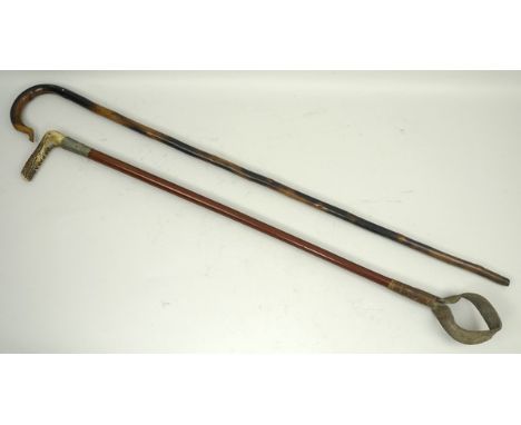 A malacca riding crop with white metal collar and antler handle grip, 72cm long, and a walking stick with crook handle, 92cm 